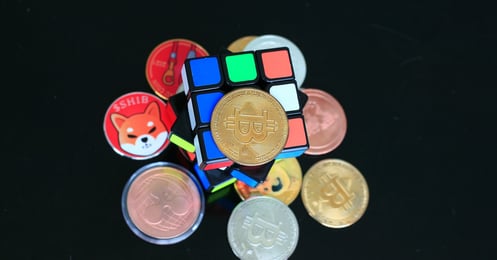 various cryptocurrency with a Rubik's cube